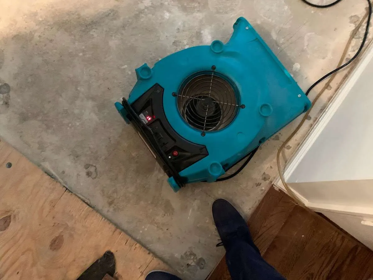 Air mover drying subfloor during Commercial Water Damage Restoration in Signal Mountain